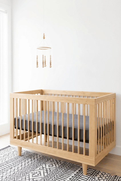 A minimalist Scandinavian nursery setup highlighting the clean lines of the Davinci Marley 3-in-1 convertible crib featured in this review.
