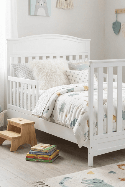The long-term value of the Delta Children Emery 4-in-1 crib shown converted into a toddler bed with the separate guardrail.