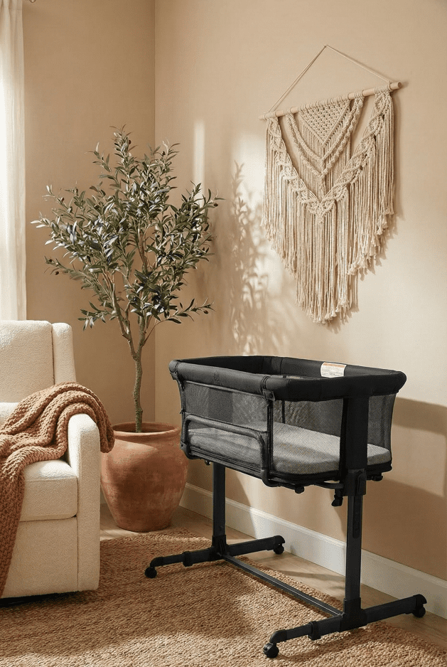 KoolerThings 3 in 1 Bassinet Review: A Safe Budget Pick? 1 The KoolerThings 3 in 1 Baby Bassinet set up in a cozy, modern bohemian nursery corner next to a nursing chair.