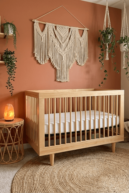 Nursery inspiration showing the Davinci Marley 3-in-1 crib styled with bohemian decor, macrame, and plants, as discussed in our review.
