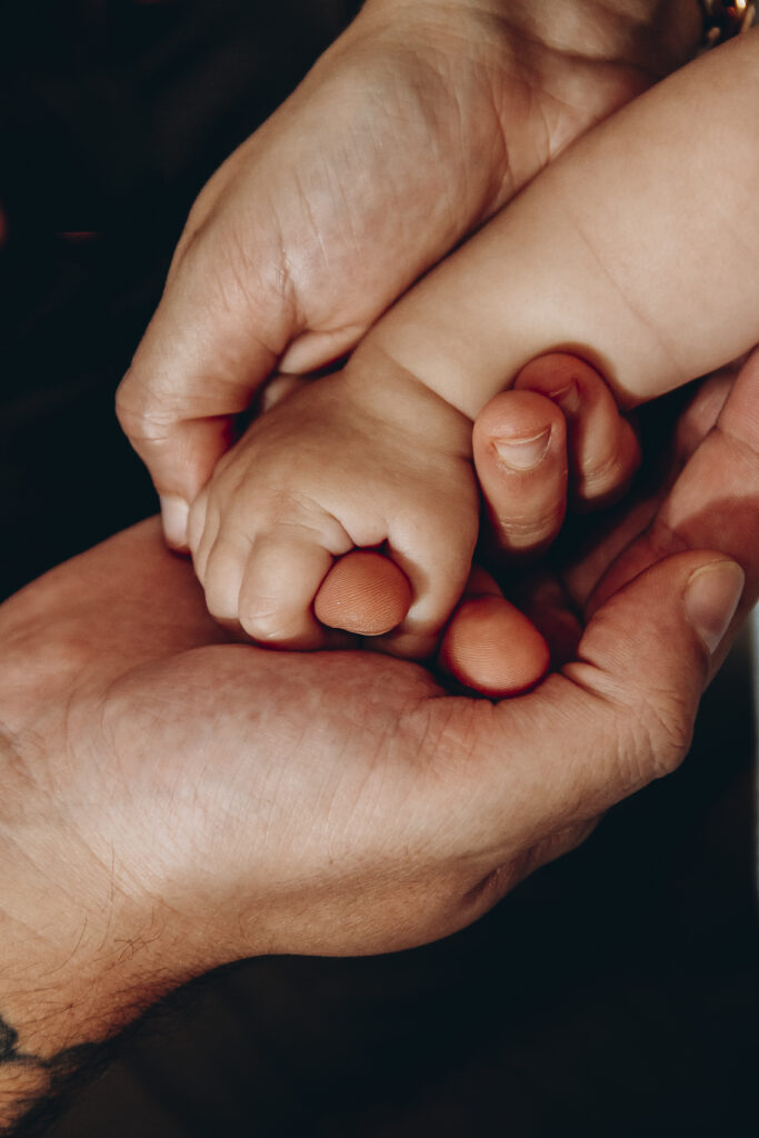 baby sleeps with hands under body