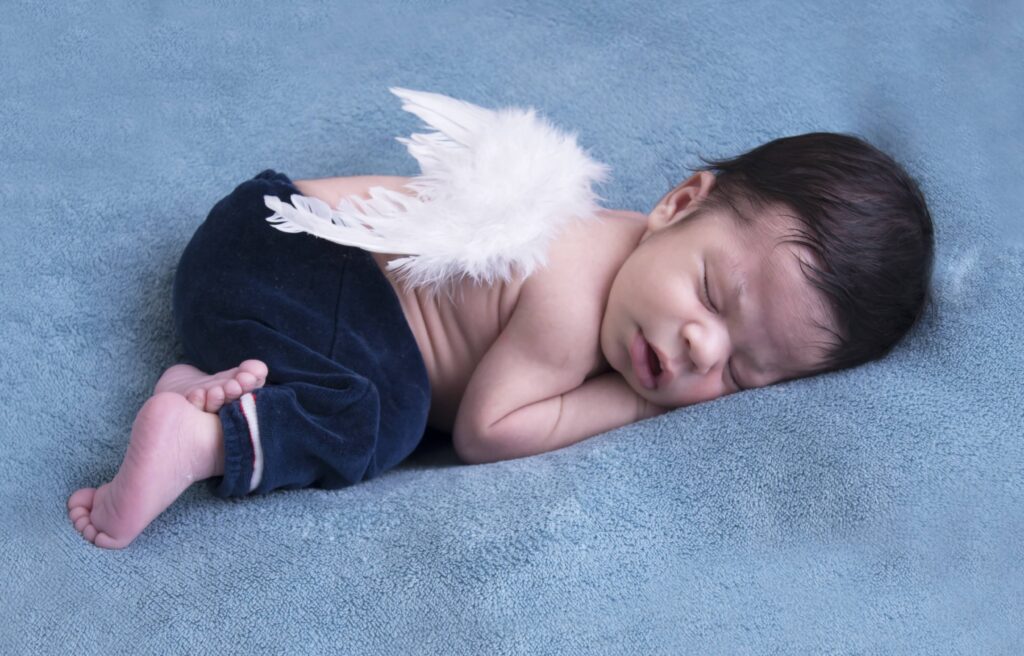 baby sleeping on side newborn