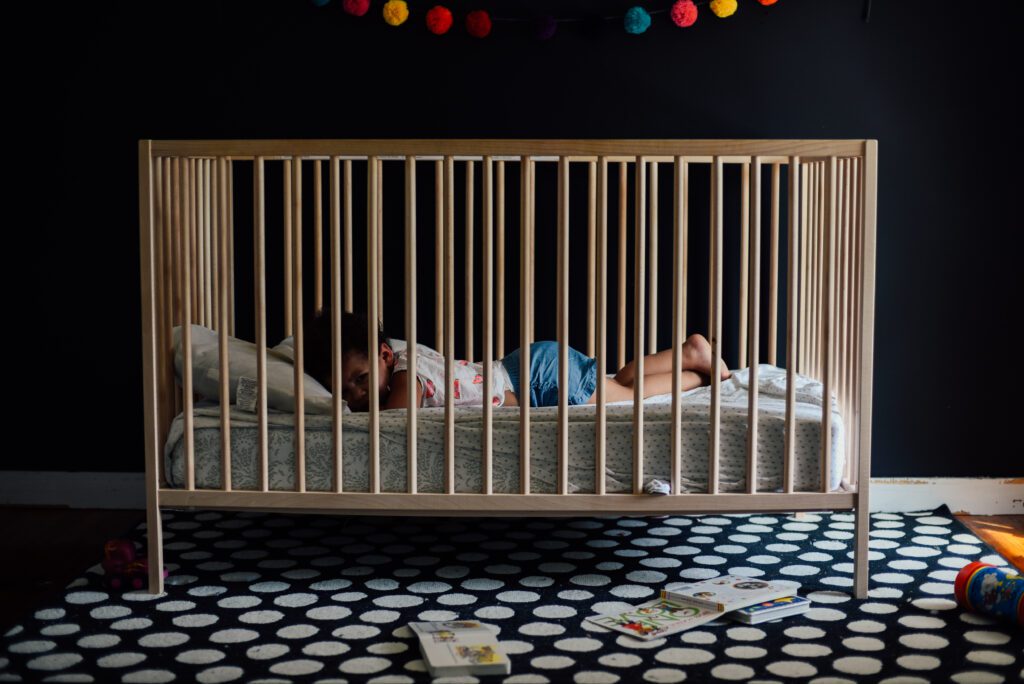 when should baby sleep in crib in own room