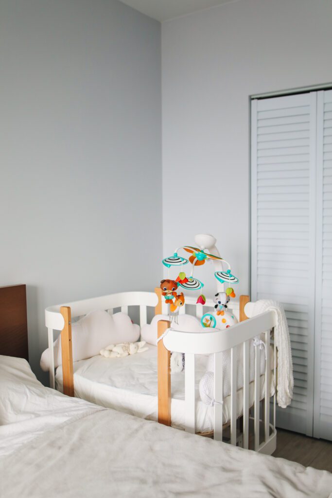 baby sleeping corner of crib