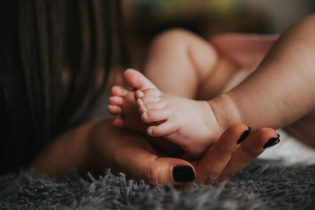 baby kicks legs up while sleeping