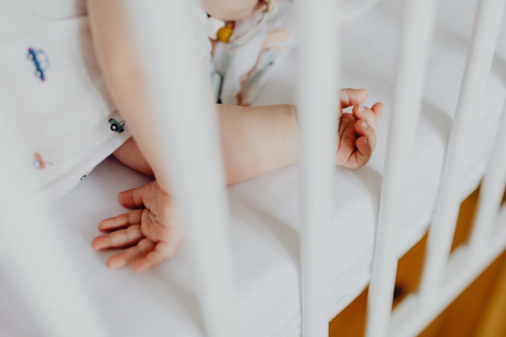 baby flailing arms and legs while sleeping