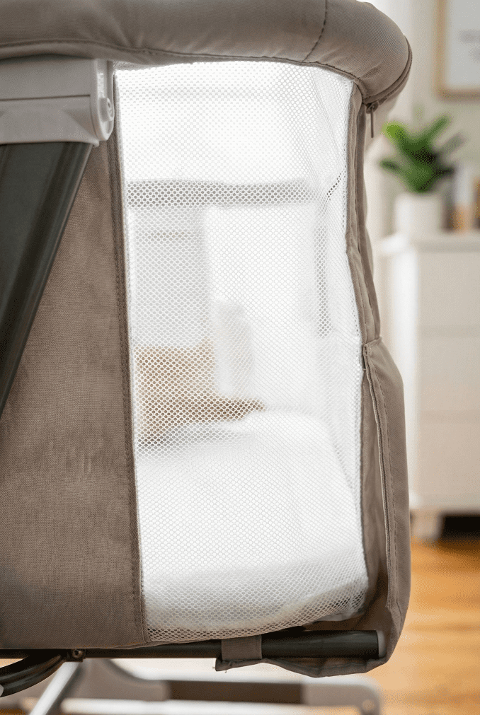 Baby Delight Beside Me Dreamer Review: A Safe Halo Alternative in 2026? 4 A vertical macro shot highlighting the sheer, breathable white mesh fabric on the sides of the Baby Delight Beside Me Dreamer bassinet, allowing for airflow and visibility.