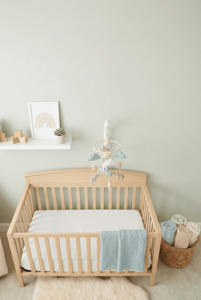 A cozy nursery setup featuring the Graco Benton crib, designed for Pinterest saving.
