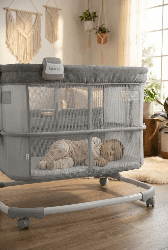 Ingenuity Dream & Grow Bassinet Review (2026): Grows With Baby? 1 An 8-month-old baby sitting up safely inside the Ingenuity Dream & Grow Bassinet, adjusted to its deep crib setting.